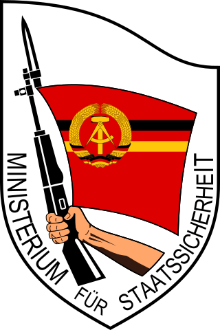 Emblem_of_the_Stasi.svg (1).png